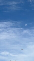 clouds and airplane in the sky.