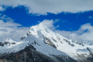 Naklejka premium Huascaran mountain range in Cordillera Blanca, Peru near city Huaraz. Peruvian mountain summits. Snow and glacier mountains of Peru. Huascaran third tallest mountain in South America Peruvian Andes