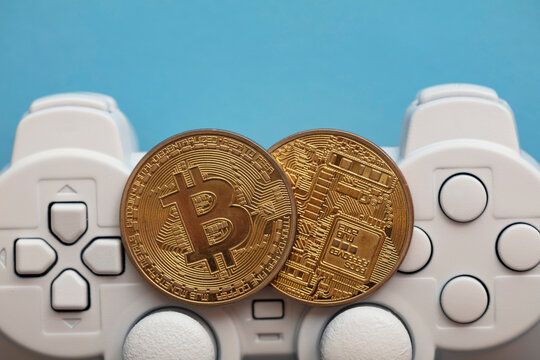 Crypto gaming concept. Video game controller with a bitcoin cryptocurrency coin