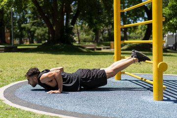 Dedicated athlete performing push-ups on a sunny day outdoors