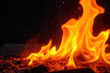 Fototapeta premium Close-up shot of vibrant orange and yellow flames licking upwards, intense heat and flickering light visible in detail , intense, bonfire, burning leaves