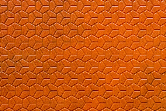 Close up view of hexagon pattern on a orange plastic cover