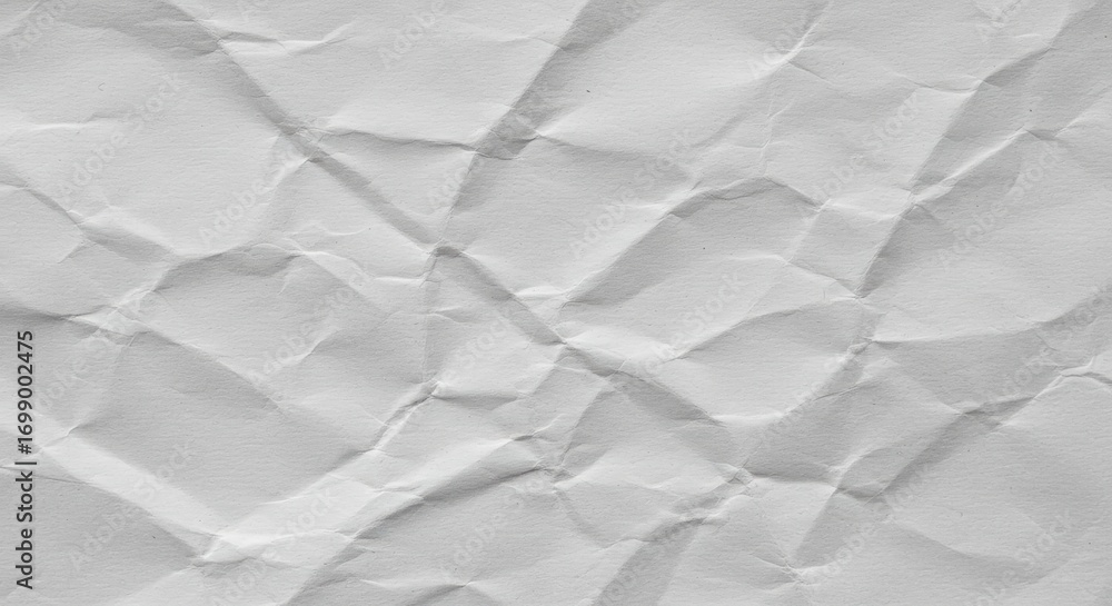 Aufkleber the textured surface of a crumpled white paper displays intricate patterns of folds and creases, cre