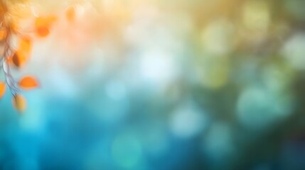 Delicate autumnal branches with vibrant orange leaves, set against a soft-focus backdrop of teal and golden hues, creates a serene and peaceful scene.