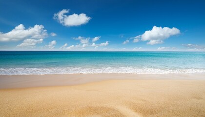 Obraz premium sunny beach scene with golden sand and calm blue sea under a bright sky with two white clouds peaceful coastal landscape capturing summer vacation and relaxation vibes