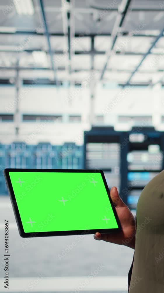 Poster vertical video server room admin uses isolated screen tablet to increase supercomputers workload cap