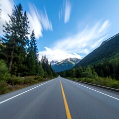 Naklejka premium Mountain road stretches into blue sky