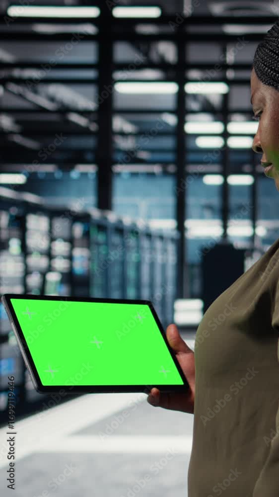 Poster vertical video data center programmer uses green screen tablet to develop disaster recovery plans, m