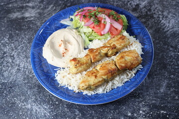 Sheesh tawook Chicken Kabob with Rice, Hummus, and Salad