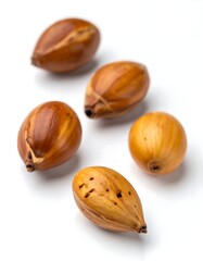 Close-up of four seeds on white