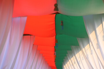 white, green and red curtain decorate for party in the garden