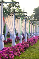 vintage light bulb hang on white curtain of party in the evening