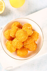 Golden Deep Fried Potato Vegetable Balls Crispy Organic Snack Food in White Bowl