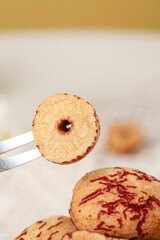 Red Dried Jujube Dates with Chopsticks for Traditional Chinese Cooking and Healthy Soup Preparation