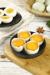 Fresh Duck Eggs with Vibrant Orange Yolks on Rustic Wooden Board - Premium Cooking Ingredients