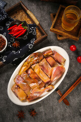 Whole Roasted Duck Sliced on Plate - Traditional Chinese Cuisine with Chopsticks and Spices