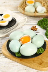 Fresh Duck Eggs with Orange Yolks on Wooden Board - Farm Fresh Ingredients for Gourmet Cooking