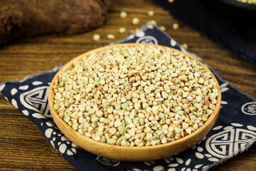 Mixed Buckwheat Grains in Wooden Bowl on Rustic Wood Table - Healthy Whole Grain Cereal Food Ingredient
