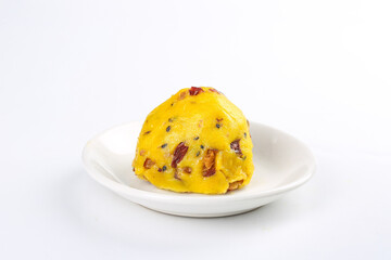 Golden Rice Cake with Red Dates and Nuts on White Plate Ready to Eat