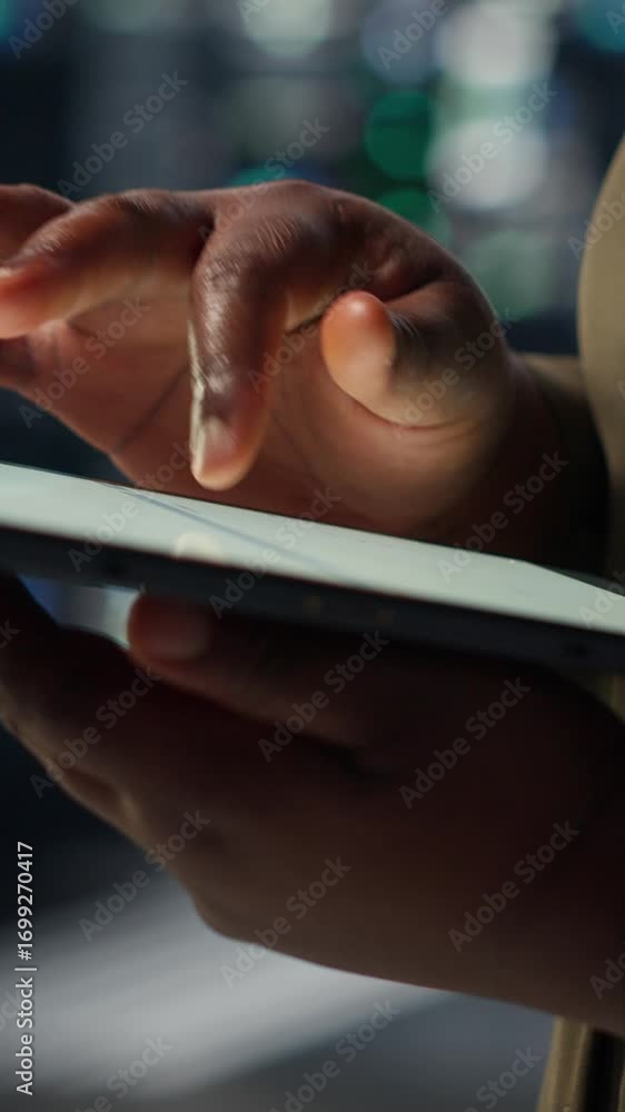 Poster vertical video close up of technician working in data center using tablet to optimize network infras