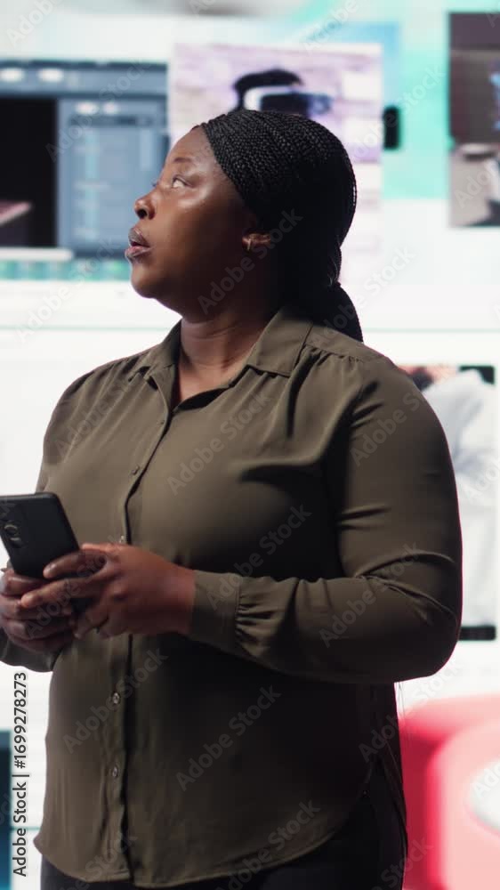 Poster vertical video woman using smartphone surrounded by curated video recommendations while browsing str