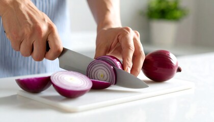 Close-up of hands chopping red onion