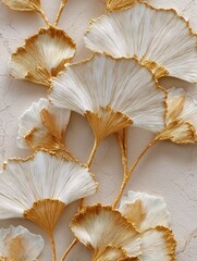 Close-up of stylized ginkgo leaves in gold and white, arranged against a textured beige background.  The leaves appear delicately painted or crafted