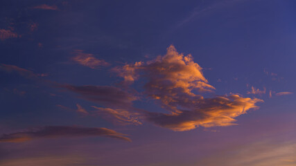 a panoramic view of purple pink orange sunset sky with big cumulus clouds, at evening,Tokyo, Japan