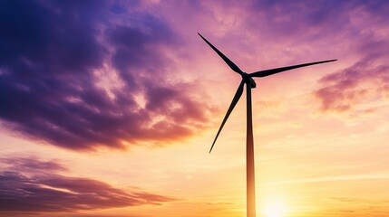Fototapeta premium A stunning silhouette of a wind turbine against a vibrant sunset sky, showcasing the beauty of renewable energy and its role in combating climate change.