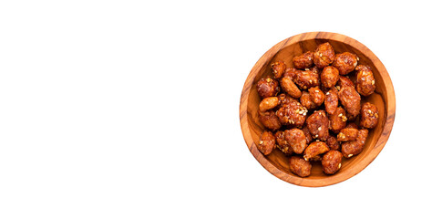 Roasted praline peanuts with white sesame seeds in a bowl - Arachis hypogaea