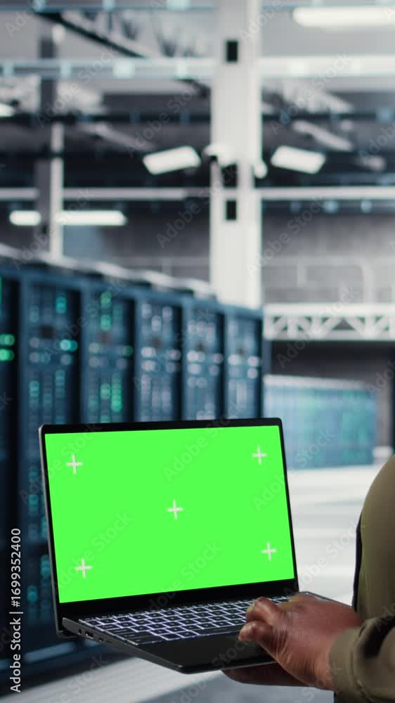 Aufkleber vertical video server room admin uses green screen laptop to upgrade mainframes for increase in work