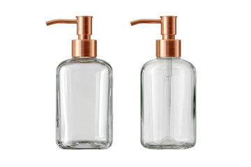Two clear glass rectangular soap dispensers with copper-colored pump tops
