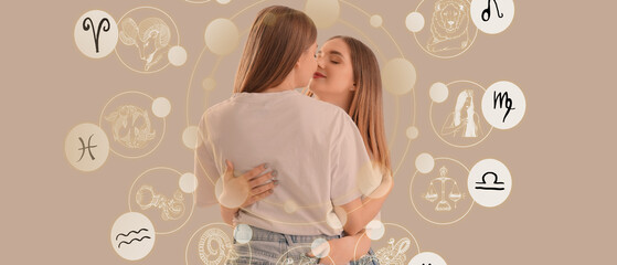 Young lesbian couple hugging on light background