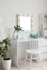 Interior of makeup room with mirror and table