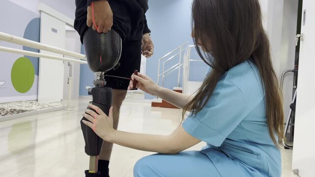 Adjusting a prosthetic leg with care in a rehabilitation center