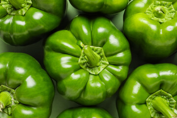 Tasty green bell peppers as background, closeup