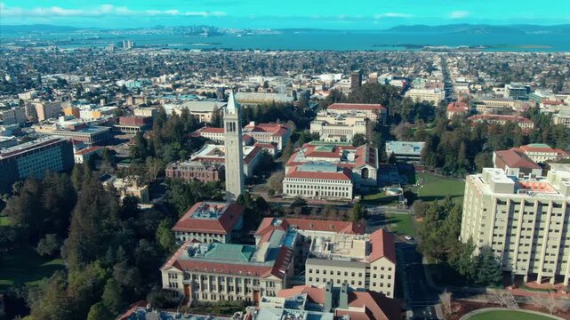 Aerial view of UC Berkeley's iconic Campanile clock tower and campus buildings, showcasing the university's architecture and urban setting in California, USA.