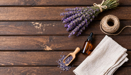 Lavender bundle with twine and spa accessories on rustic wooden background