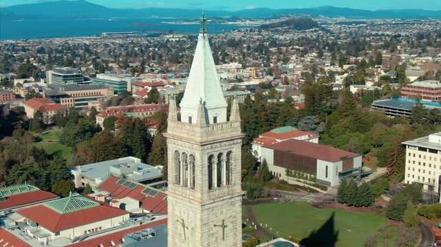 Aerial view of UC Berkeley's iconic Campanile clock tower and campus buildings, showcasing the university's architecture and urban setting in California, USA.