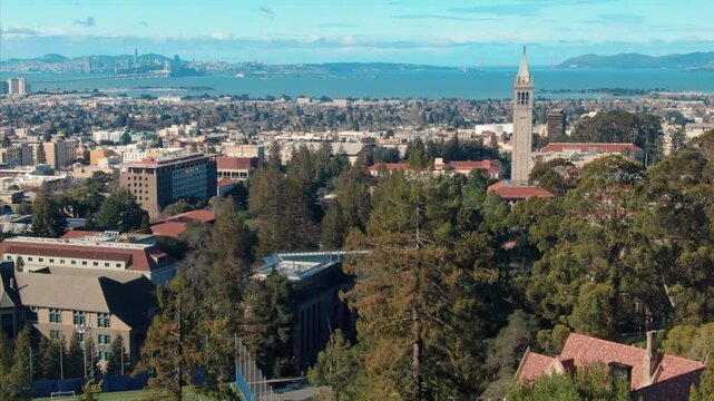 A scenic view of the University of California Berkeley Campanile, with San Francisco and the Bay in the background. A popular tourist destination in the USA.