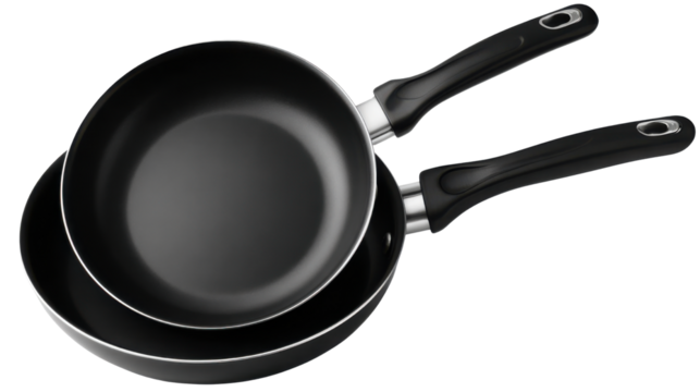 Stacked frying pans on white background