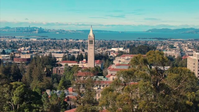 A scenic view of the University of California Berkeley Campanile, with San Francisco and the Bay in the background. A popular tourist destination in the USA.
