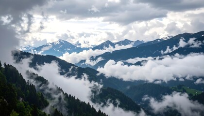 Fototapeta premium Mountain range shrouded in clouds
