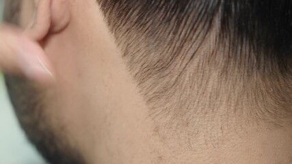 Expert haircut technique in a busy barbershop