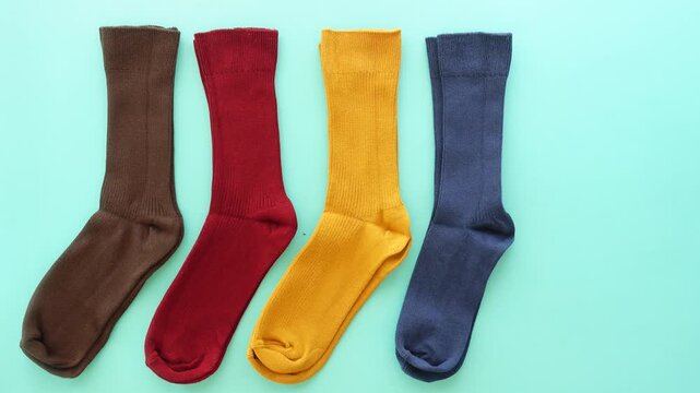 Colorful socks displayed on a light blue background