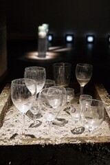 Contemplative Still Life. Empty Glassware in Sand, Evoking Memory and Reflection, Art Installation.