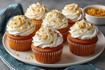 Delicious Golden Cupcakes with Creamy Frosting and Decorations