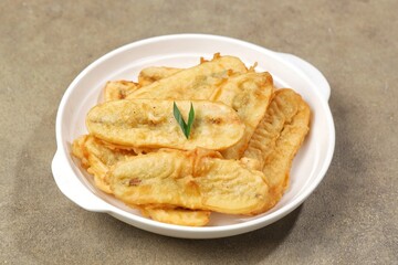 Pisang Goreng. Fried bananas are a snack that is often found in Indonesia, Malaysia, India and Singapore. This food is made from bananas that have been peeled