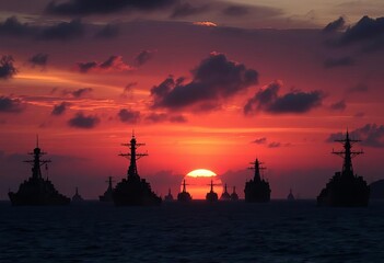 Naklejka premium Dark silhouettes of various warships on water at sunset, naval vessel, naval