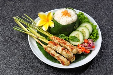 Sate Lilit is a variant of satay from Bali. This satay is made from pork, fish, chicken or beef, then mixed with grated coconut, coconut milk, lime, shallots and pepper.